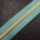 Zip SB grosse spirale émeraude et or au 10 cm